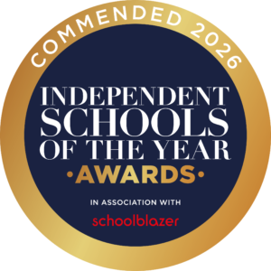 Circular award badge: navy center with white text 'INDEPENDENT SCHOOLS OF THE YEAR' and a gold gradient rim, 'AWARDS' at bottom.